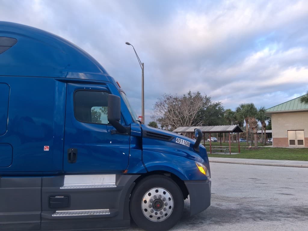 Nulien Transportation tractor at Palm Bay, Florida, with palm trees in the background